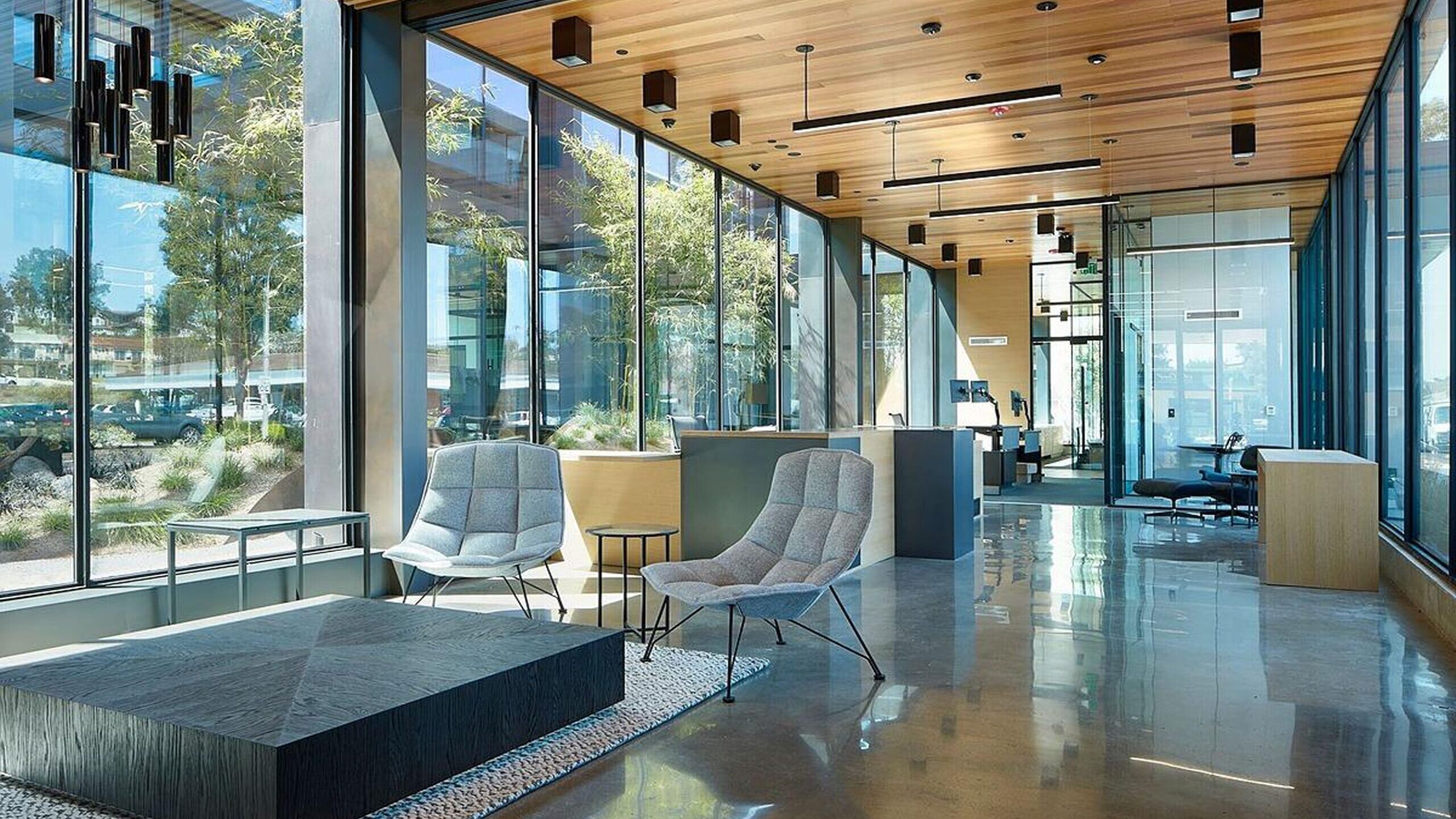 Elegant interior with floor-to-ceiling glass walls by ClearEdge